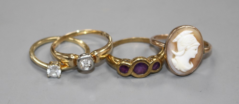 Four assorted 9ct and gem set rings.